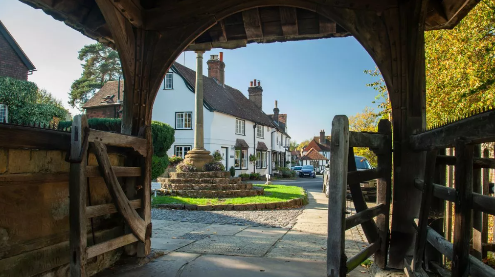 Images of the best villages in Surrey such as Farnham, Godalming, Shere, and others showcasing their scenic beauty and historic architecture.