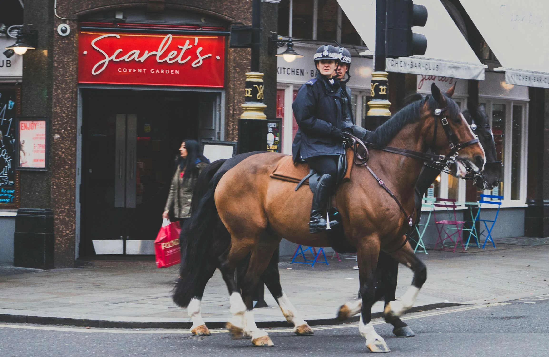 Man Riding on Brown Horse
